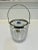 Offering a leaded glass bucket in a diamond pattern with a silver plated wide rim, handle and accompanying tongs. Made by...