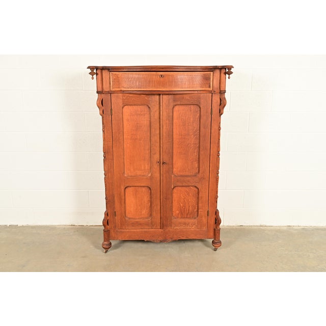 A gorgeous antique Victorian armoire dresser, wardrobe, or gentleman's chest In the manner of R.J. Horner & Co. USA, Circa...