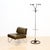 A sleek Bauhaus style coat stand dating from the 1970s, featuring a polished chrome tubular steel frame with contrasting...