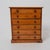 Authentic mid-19th century American cherry spice chest, dating to circa 1840. This finely crafted piece features six small...