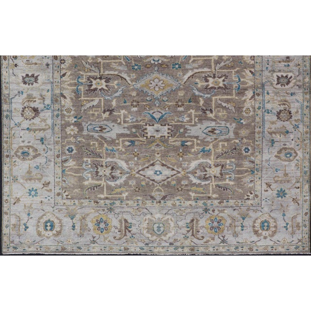 Measures: 9'0 x 10'6 Modern Heriz Geometric Rug in Earthy Browns and Soft Blues 9'0 x 10'6. Keivan Woven Arts/...