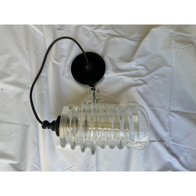 Waterworks clear ribbed glass insulator-style pendent with chord and backplate/canopy; industrial farmhouse style.
