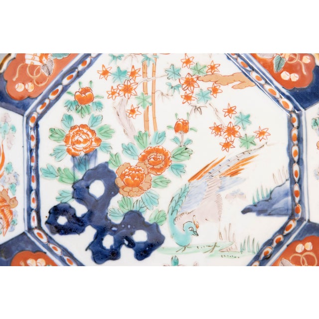 A gorgeous 19th-Century Japanese Meiji Period Imari octoganal porcelain charger. This fine large plate has hand painted...
