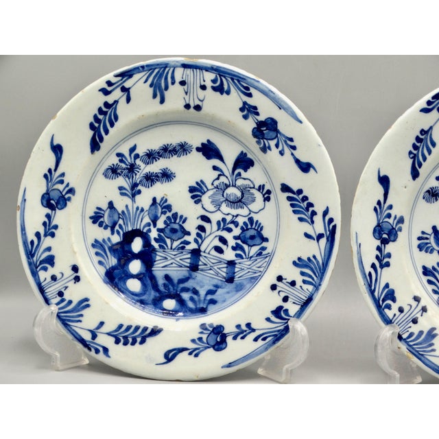 Fine quality pair of late 18th-Century Delftware plates. These antique plates are hand painted in cobalt blue with a...
