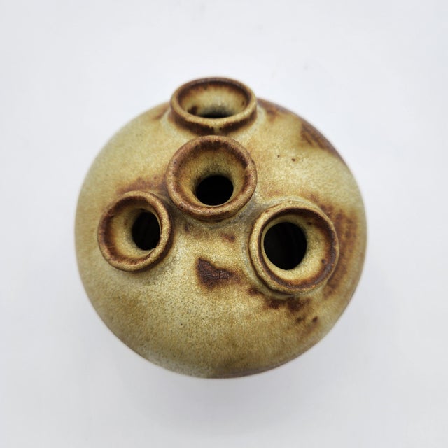 Globular stoneware bud vase with four tubular openings, variegated olive and brown ash glaze with brushed banding, signed...