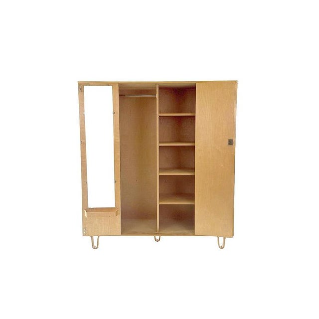 This vintage pastoe kb04 “ wardrobe ” by cees braakman is a stunning example of the clean, functional dutch design of the...