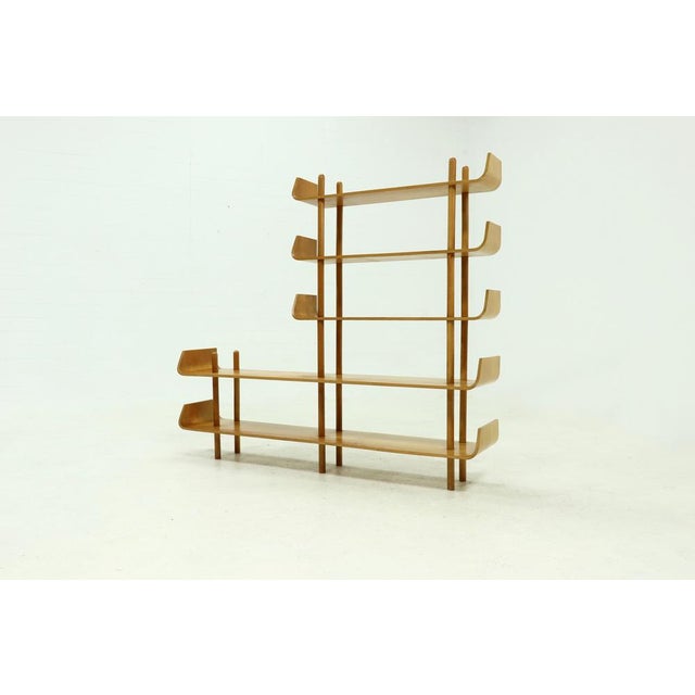 Freestanding bookcase / shelving unit designed by Willem Lutjens for Gouda den Boer in 1953. Featuring birch stands and...