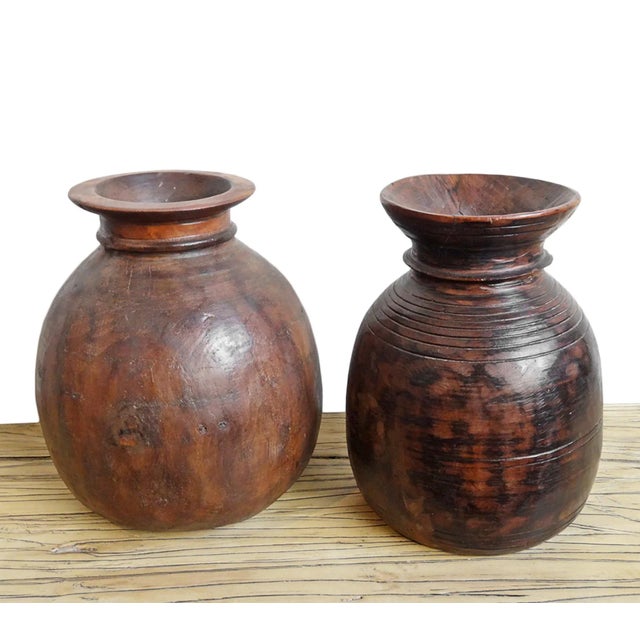 Authentic vintage carved teak wood pot from North India. Originally used to store various oils for cooking. Each is unique...