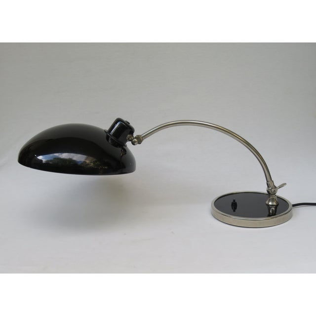 A desk lamp in the typically austere style of the bauhaus era, manufactured in germany by hala - hannoversche lampenfabrik...
