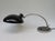 A desk lamp in the typically austere style of the bauhaus era, manufactured in germany by hala - hannoversche lampenfabrik...
