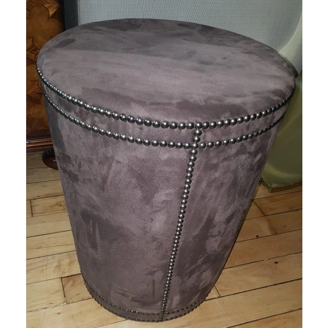This is a Bernhardt showroom sample of the Pomona Ottoman. Chocolate brown Tapered cylinder with nailheads. Diameter 18"...