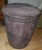 This is a Bernhardt showroom sample of the Pomona Ottoman. Chocolate brown Tapered cylinder with nailheads. Diameter 18"...