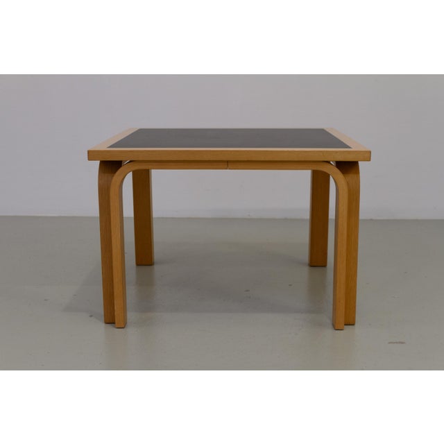 Danish Oak and Black Botium Lounge Table by Magnus Olesen, 1970s. Scandinavian Mid-Century Modern coffee table in steam...