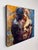 In "Heartstrings," two figures engage in an intimate embrace, their forms rendered in rich, contrasting hues that evoke...