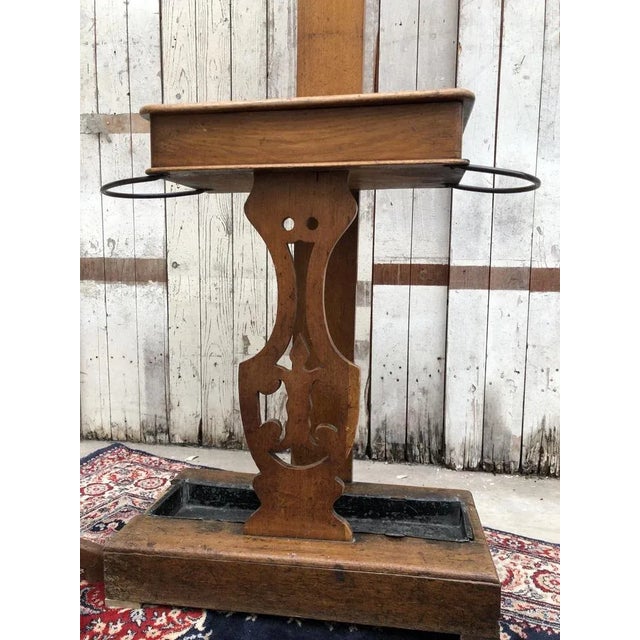 Antique Dutch hall stand dating from the mid-19th century, circa 1840. Made from elm with a warm natural patina, this...