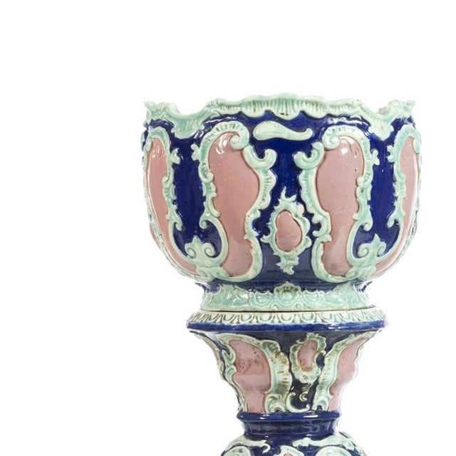 Porcelain - Pair of cachepots with columns. French; early 20th century ceramic with polychrome and relief decoration....