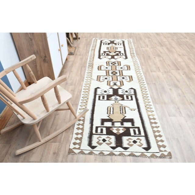 Vintage Turkish Hand-Knotted vintage rug is a semi- vintage runner rug.'70s Eastern region of Turkey's unique rug is...