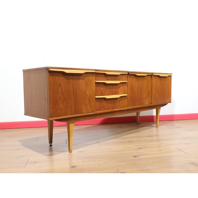 A beautiful classic sideboard by renowned furniture in the manor of Stonehill, this Mid Century Modern Vintage British...