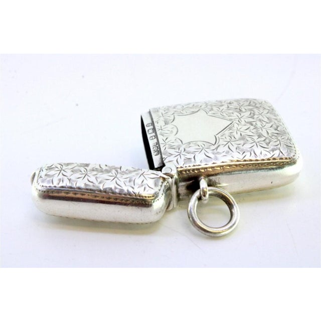Silver Matchbox with Engraved Plant Motifs and Monogram Card, in Very Good conditions. Designed 1890 to 1919 This piece...