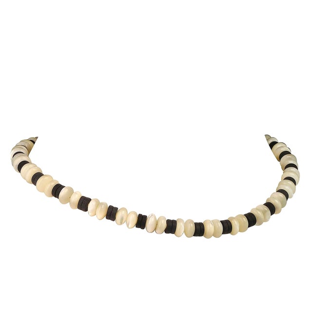 This is part of Chairish’s Fine Jewelry assortment. Elegant Handmade Mother of Pearl and Matte Black Onyx Choker Necklace...