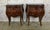An enchanting and highly desirable pair of French Louis XV style bombé nightstands, or petite commodes, circa mid-20th...
