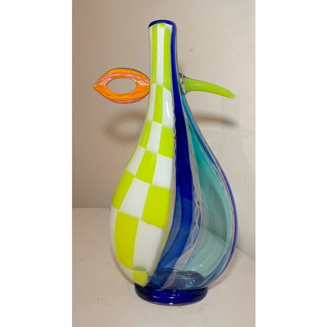 Elevate your space with the striking presence of this exquisitely large hand-blown glass centerpiece vase, a true...