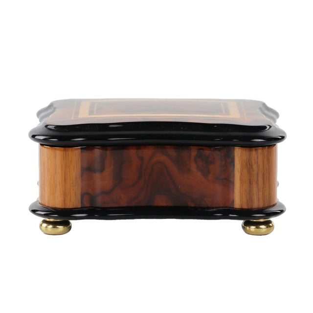 Small Reuge music box in walnut case with drum mechanism. Performs Solveiga`s Song by Edward Green. The lid acts as a...