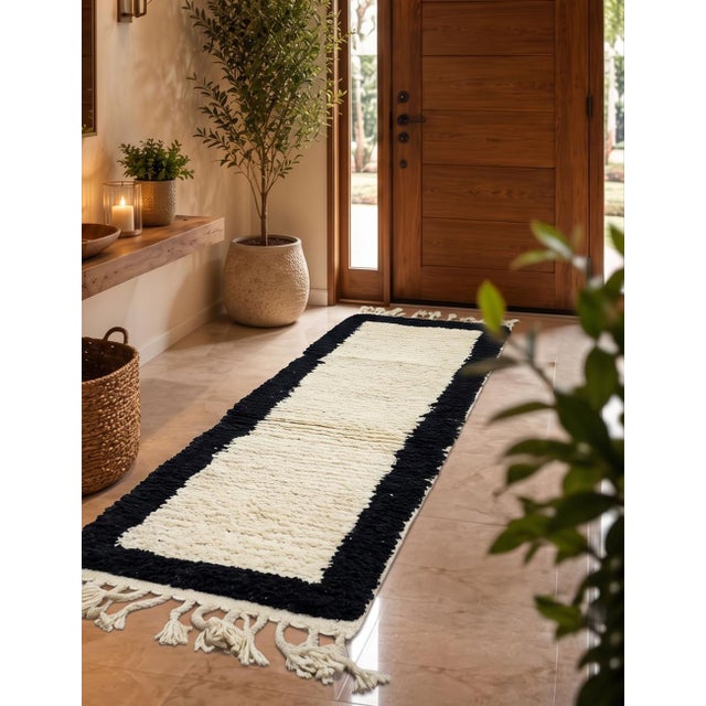 Boujad Runner Rug | Handwoven Berber Wool Runner with Ivory Field and Black Border This clean, minimal Boujad runner...