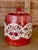 A richly decorated vintage Japanese porcelain covered jar, hand-painted in the Kutani style with vivid red enamel, gilt...