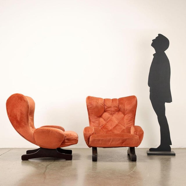 Pair of armchairs, sprung and foam padding, original period velvet upholstery, wooden legs. This piece is attributed to...