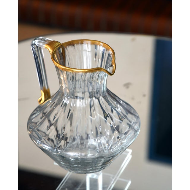 Daum nancy france, circa 1900. a hemispherical pitcher (jug) made of blown clear glass, hot-formed with a tool and...