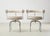 Iconic pair of lc7 swivel chairs, designed by charlotte perriand in 1927. originally she designed the chairs for her own...