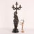 Bronze candelabra with five flames. On a circular base in black marble rests a bronze statue depicting Diana the Huntress...