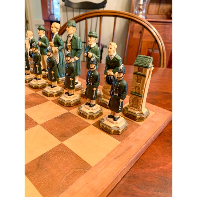 A remarkable Studio Anne Carlton British Sherlock Holmes Chess Set, expertly handcrafted in Great Britain and beautifully...