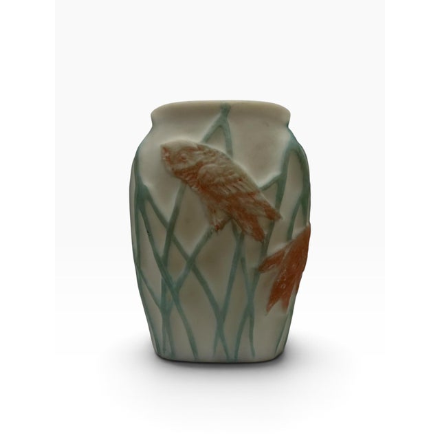 Add a touch of early 20th-century American craftsmanship to your inventory with this authentic antique art glass vase by...
