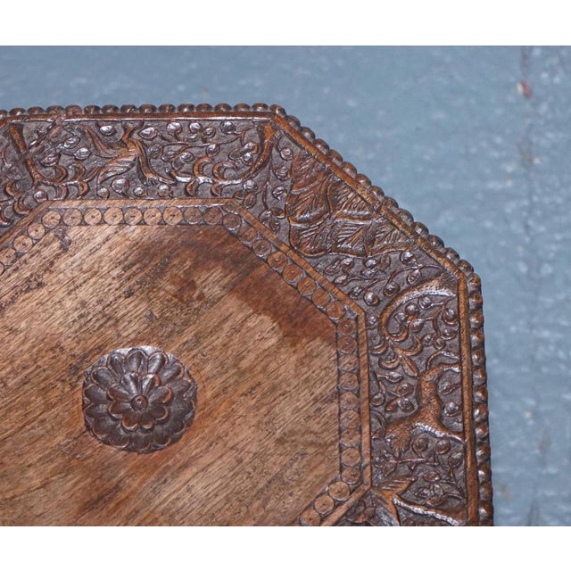 Antiques of London Late 19th to early 20th century Anglo-Indian octagonal side table, intricately hand-carved from dense...
