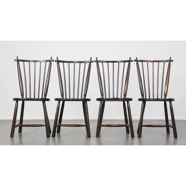 This set of 4 vintage wooden De Ster Gelderland design bar chairs. This set of 4 charming vintage bar chairs is a...