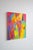 Geometric abstraction paired with a rainbow of colors creates a striking work that can make a statement in any room.