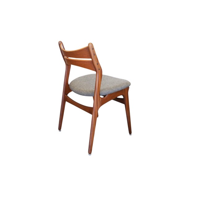 Exclusive and carefully crafted chairs in solid, oiled teak. Model 310 was designed by Danish furniture designer Erik Buch...