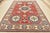 This traditional tribal geometric Caucasian Kazak rug is hand-knotted with an all-wool pile on a cotton foundation. This...