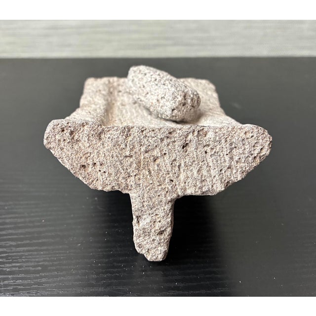 Discover a rare piece of ancient history with this authentic Pre-Columbian tripodal metate and mano set, originating from...