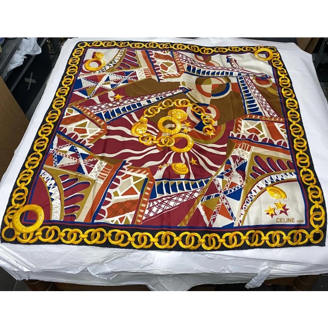 An elegant silk scarf by Celine Paris with iconic colors of the maison, it's in perfect conditions