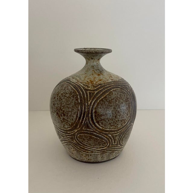 Handcrafted ceramic vase with brown & taupe abstract design. Artist signed and dated.