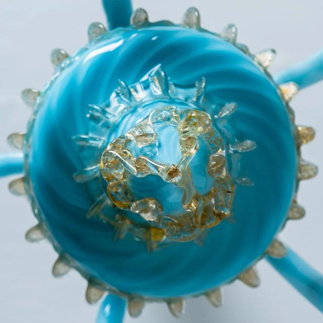 An elegant hand-blown murano glass chandelier of barovier & toso, italy. Manufactured late 1960s, early 1970s. The light...