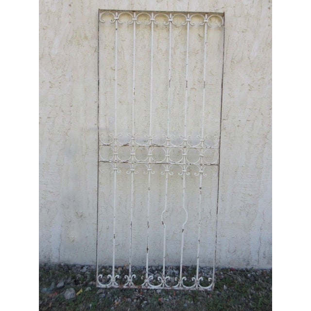 This iron gate/door is a wonderful piece of architecture. Heavy, tight, and sturdy. This piece does show signs of age...