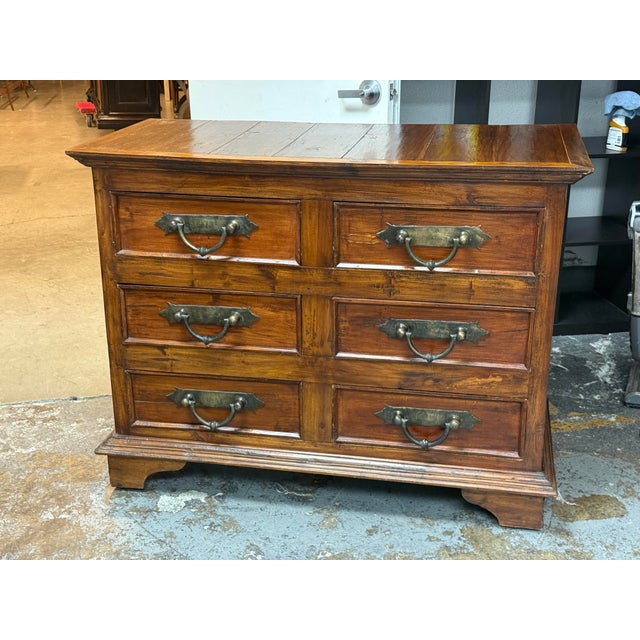 Design Plus Gallery presents a Rustic Spanish Colonial Style Dresser. The wood dresser has a rectangular plank top,...