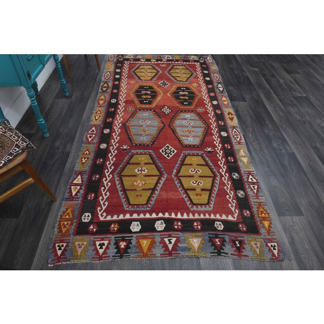 Vintage Hand-Knotted runner rug is a semi-antique vintage runner rug. The '70s Eastern region of Anatolia's unique rug is...