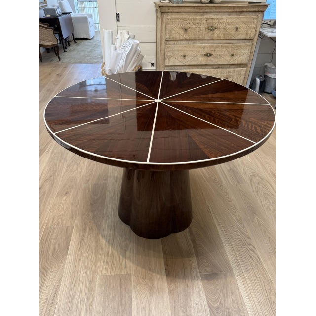 Spokes of exquisite bone inlay contrast with shiny oak or shiny teak in our Novak entry table's exquisite top. The solid...