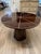 Spokes of exquisite bone inlay contrast with shiny oak or shiny teak in our Novak entry table's exquisite top. The solid...