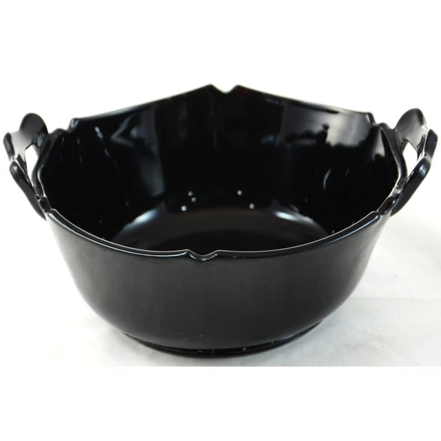 Antique deep black glass bowl with a notched rim and two handles. No maker's mark. Attributed to L.E. Smith black amethyst...